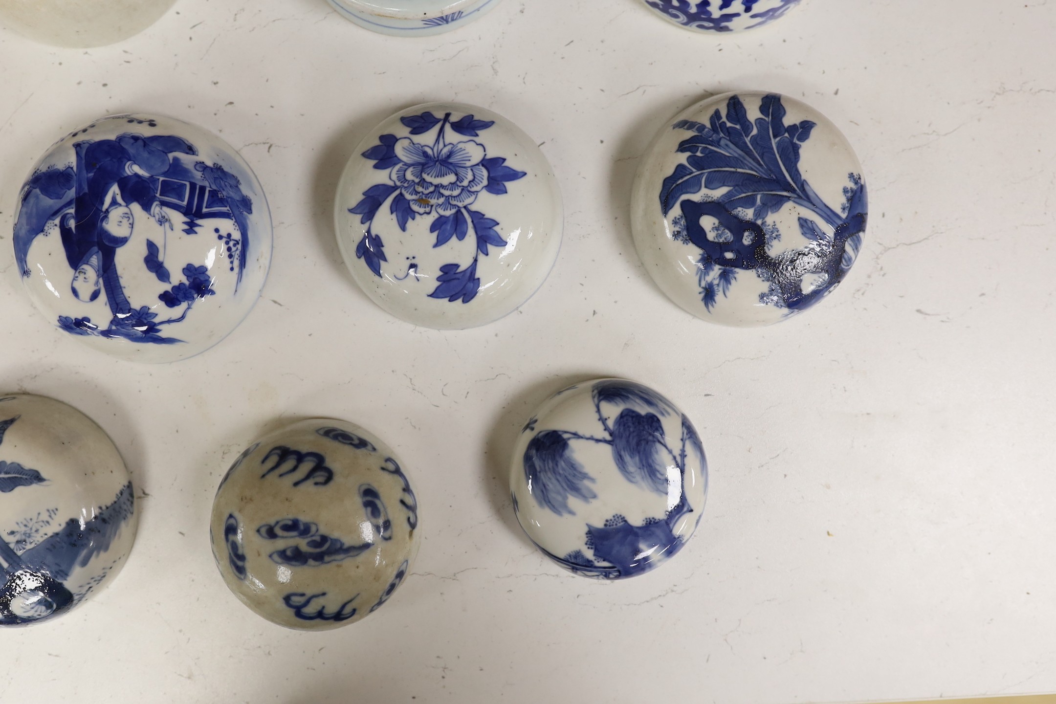 Fifteen 18th/19th century Chinese blue and white jar covers, largest 13.3cm diameter, Provenance - D.C.Monk & Son, former dealers based in Kensington Church Street, London W8